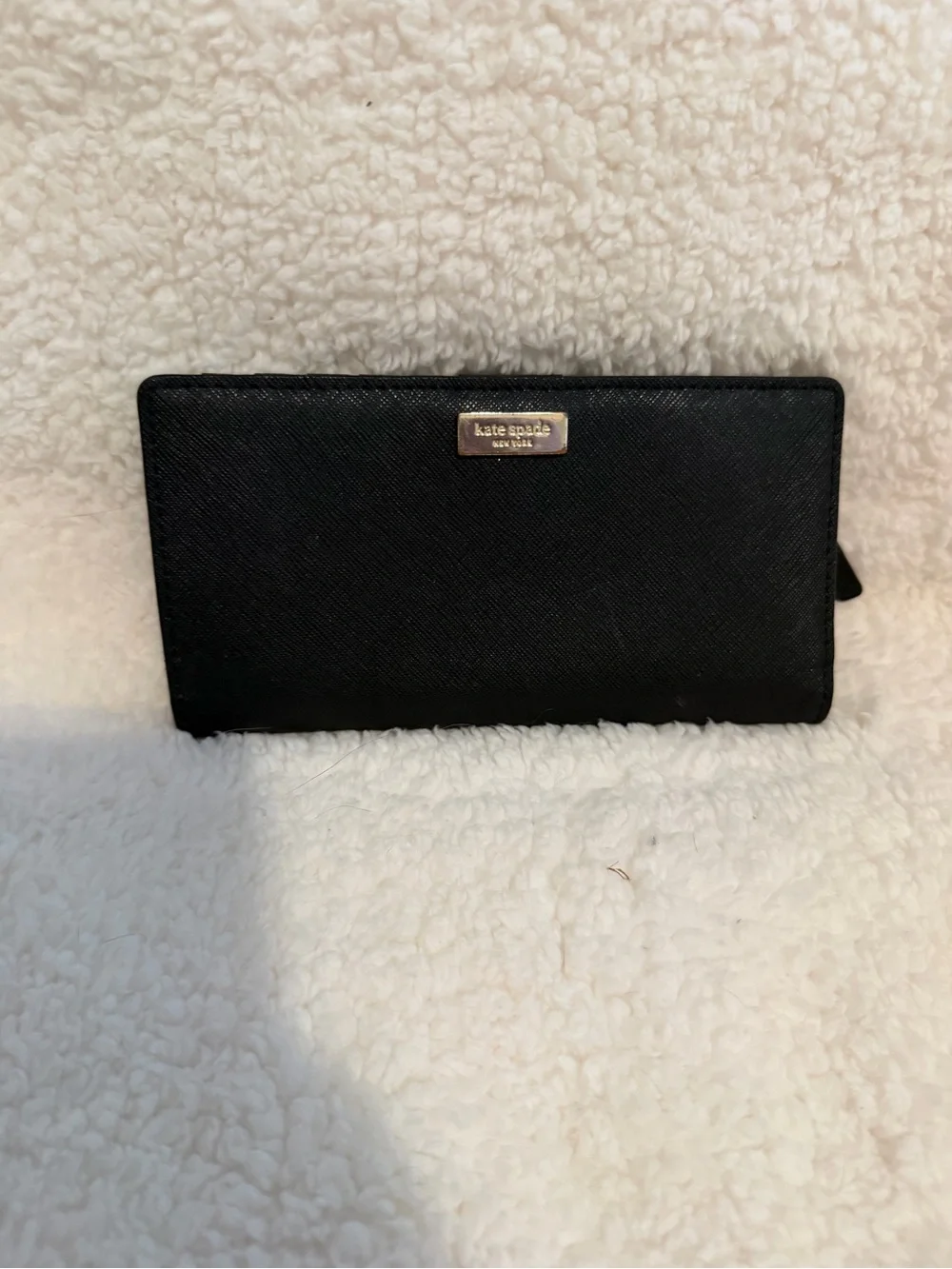 kate spade black textured zip-around wallet with gold plaque